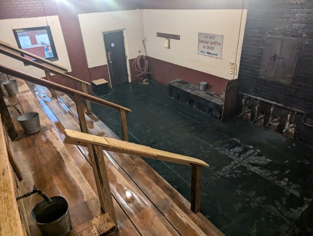 Wooden bleachers in a steam room. 